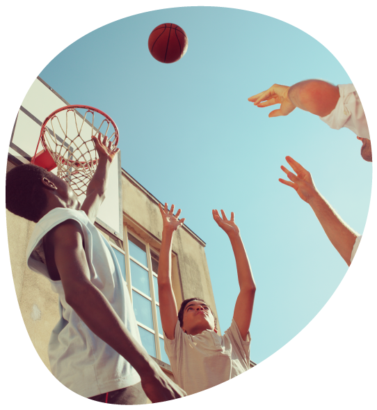 A group of boys playing basketball.